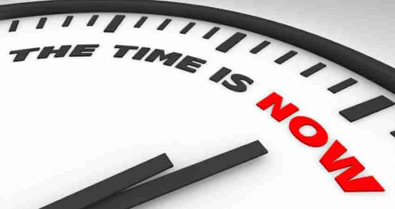 A clock face with the words THE TIME IS NOW; NOW is in bold red letters, emphasizing urgency and importance.