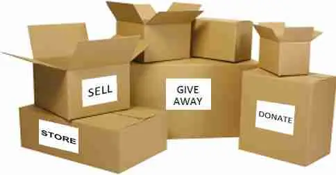 Five cardboard boxes with labels: STORE, SELL, GIVE AWAY, and DONATE. Some boxes are open, and they are grouped together, representing different ways to organize or declutter belongings.
